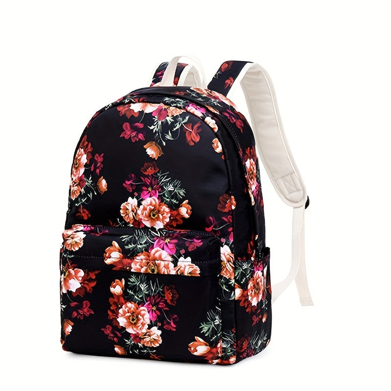 Conjunto de mochila escolar fashion com estampa floral, lancheira e estojo, feito em nylon resistente e leve, com fechamento em zíper.